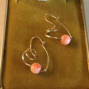 Goldtone costume earrings with pink/coral bead.